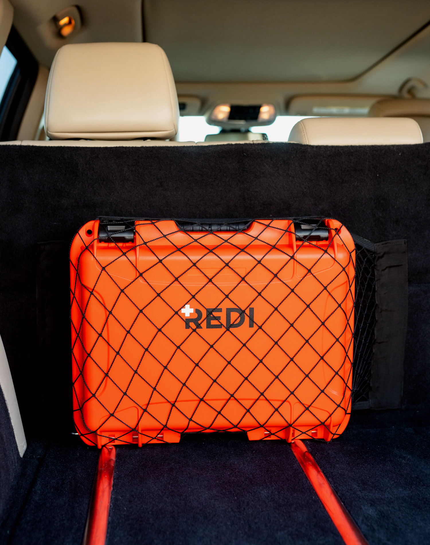 The Roadie Pro + inside a velcro cargo net in the trunk of an SUV.