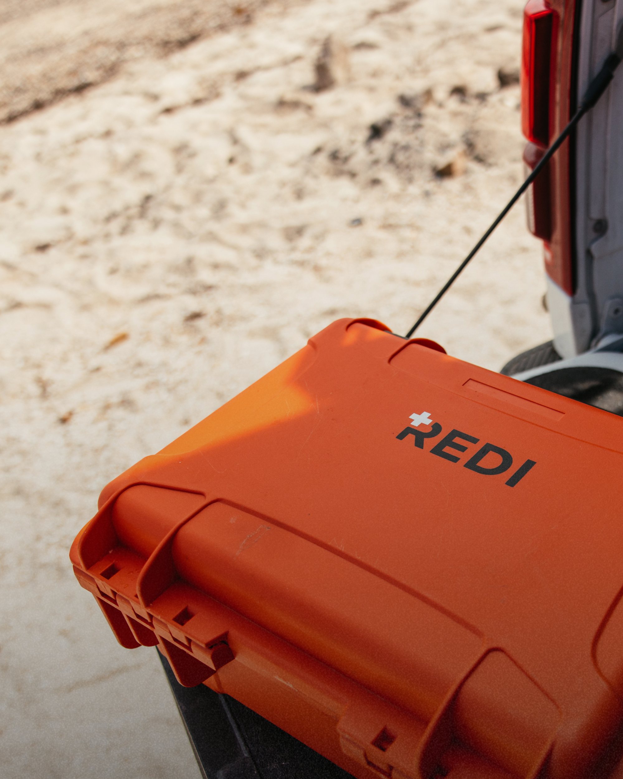 A close up shot of the Roadie Pro + hardshell case sitting in the back of a truck. 
