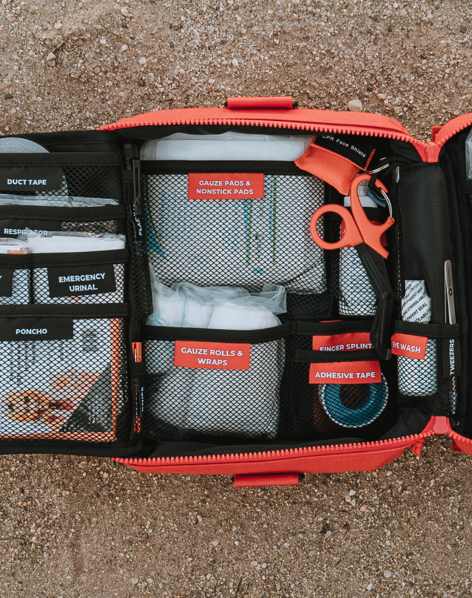 An up close photo of the Roadie open and its labeled pouches for each first aid item